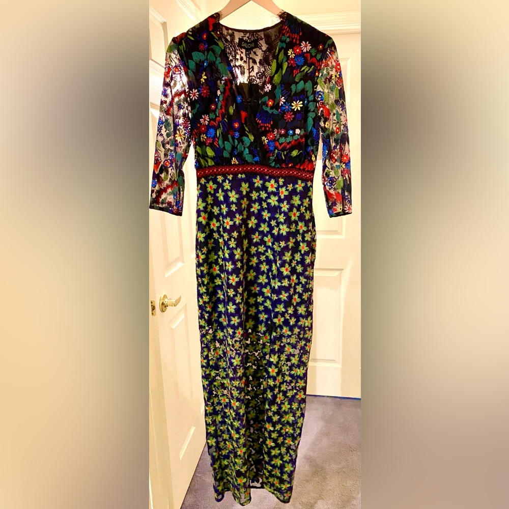 Stunning and seductive Jennifer Saloni dress new with tags.  Size US 4.